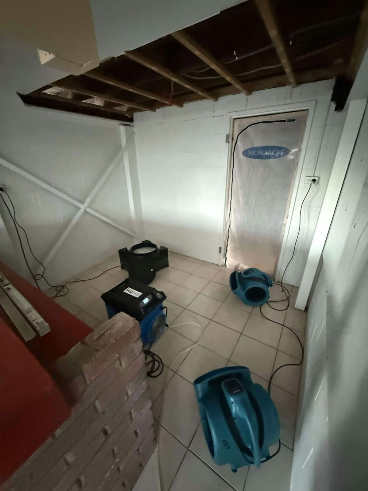 Water-stained ceiling area photographed safely away from the damaged section