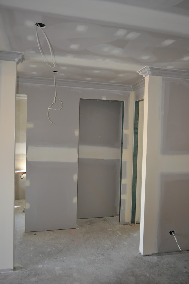 Wall lining edge beside a doorway showing the depth available for replacement board