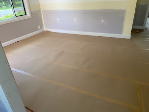 Protected passage beside a contained renovation plastering work area